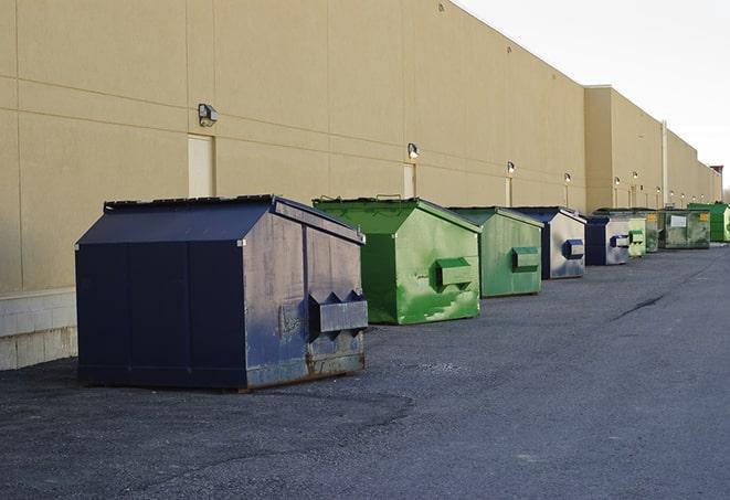 an assortment of sturdy and reliable waste containers near a construction area in Bee Cave TX