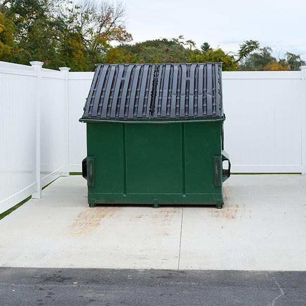 all of our commercial dumpsters come with lids to keep debris contained and prevent weather damage